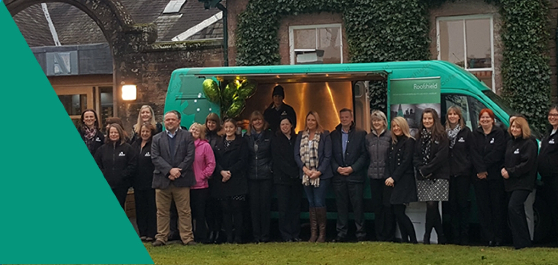 Members of the A.Proctor Group team gather outside their UK tour van