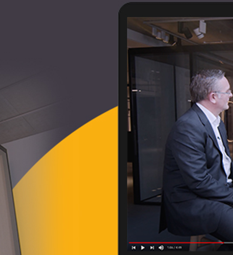 TV presenter, Ortis Deley, interviewing Optima's design team about the benefits of Optima's new Adaptable Meeting Room (AMR) product